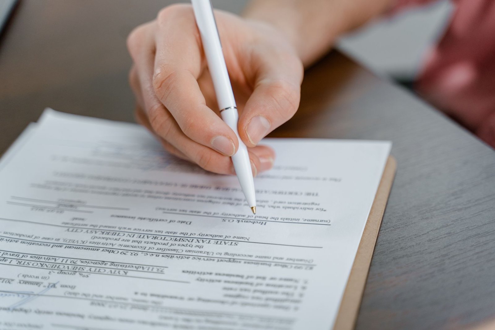 Veteran filling out VA disability claim forms related to Marine Corps asbestos exposure