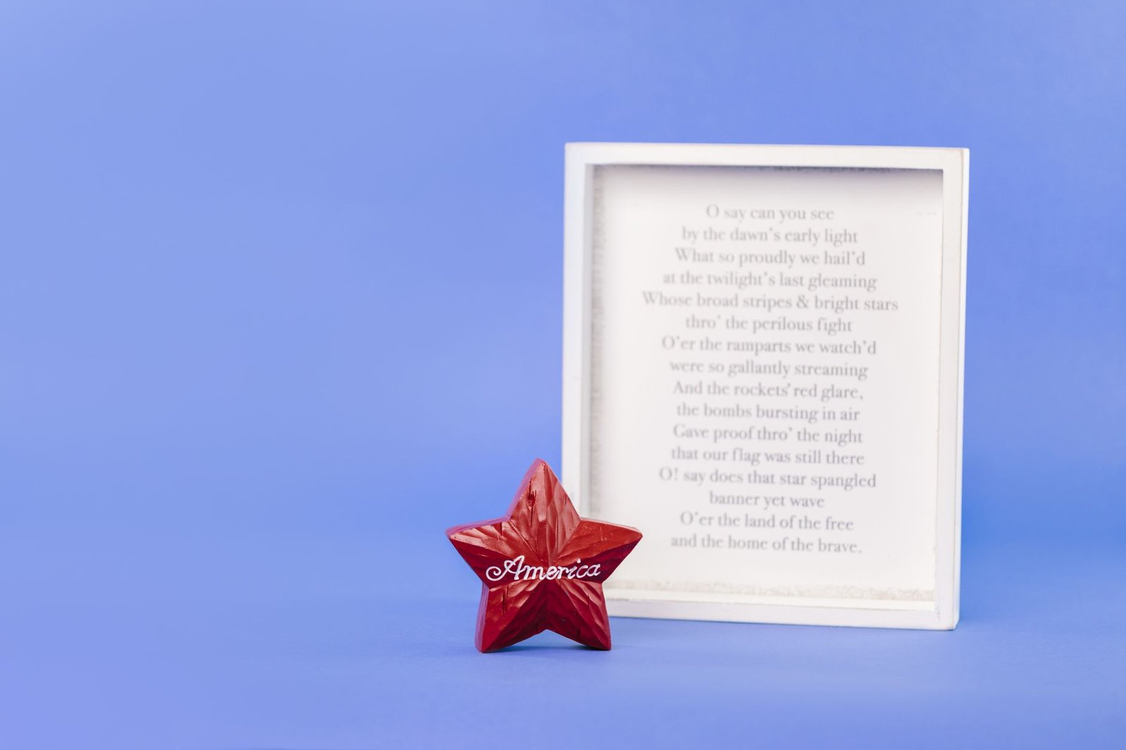 Folded American flag and framed service photo honoring a Marine veteran affected by asbestos exposure