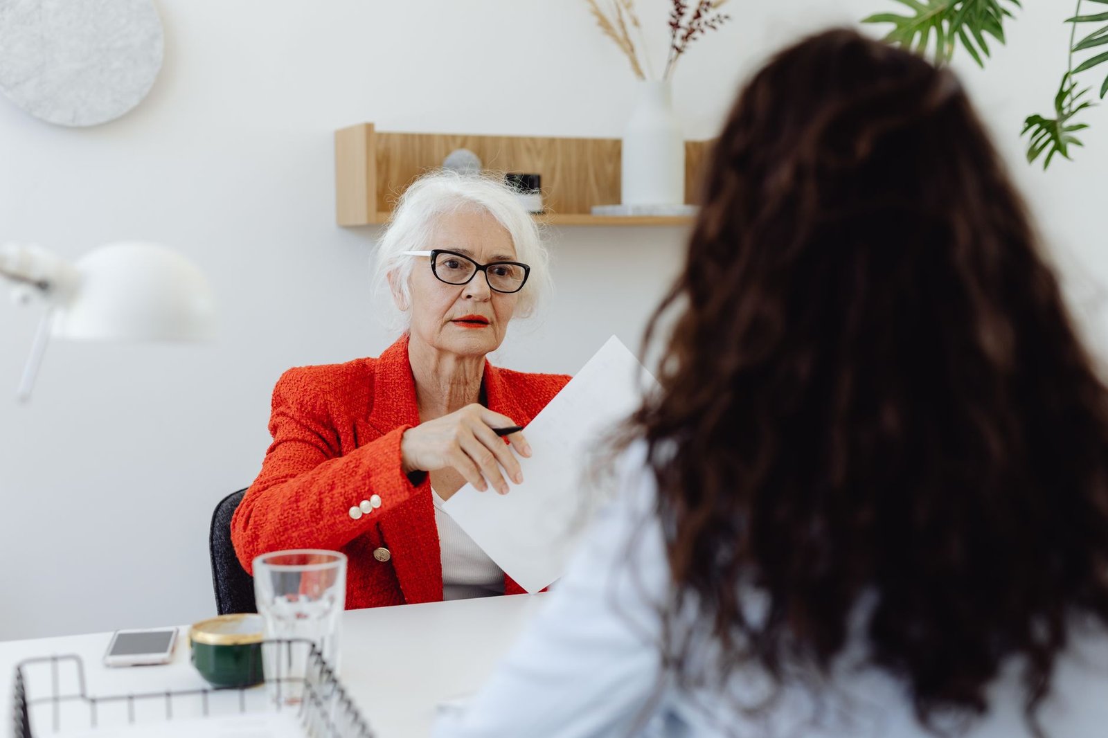 Surviving spouse discussing Social Security survivor benefits and DIC paperwork with an advisor